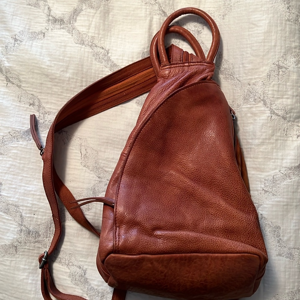 Free People backpack never used/Soho Sling